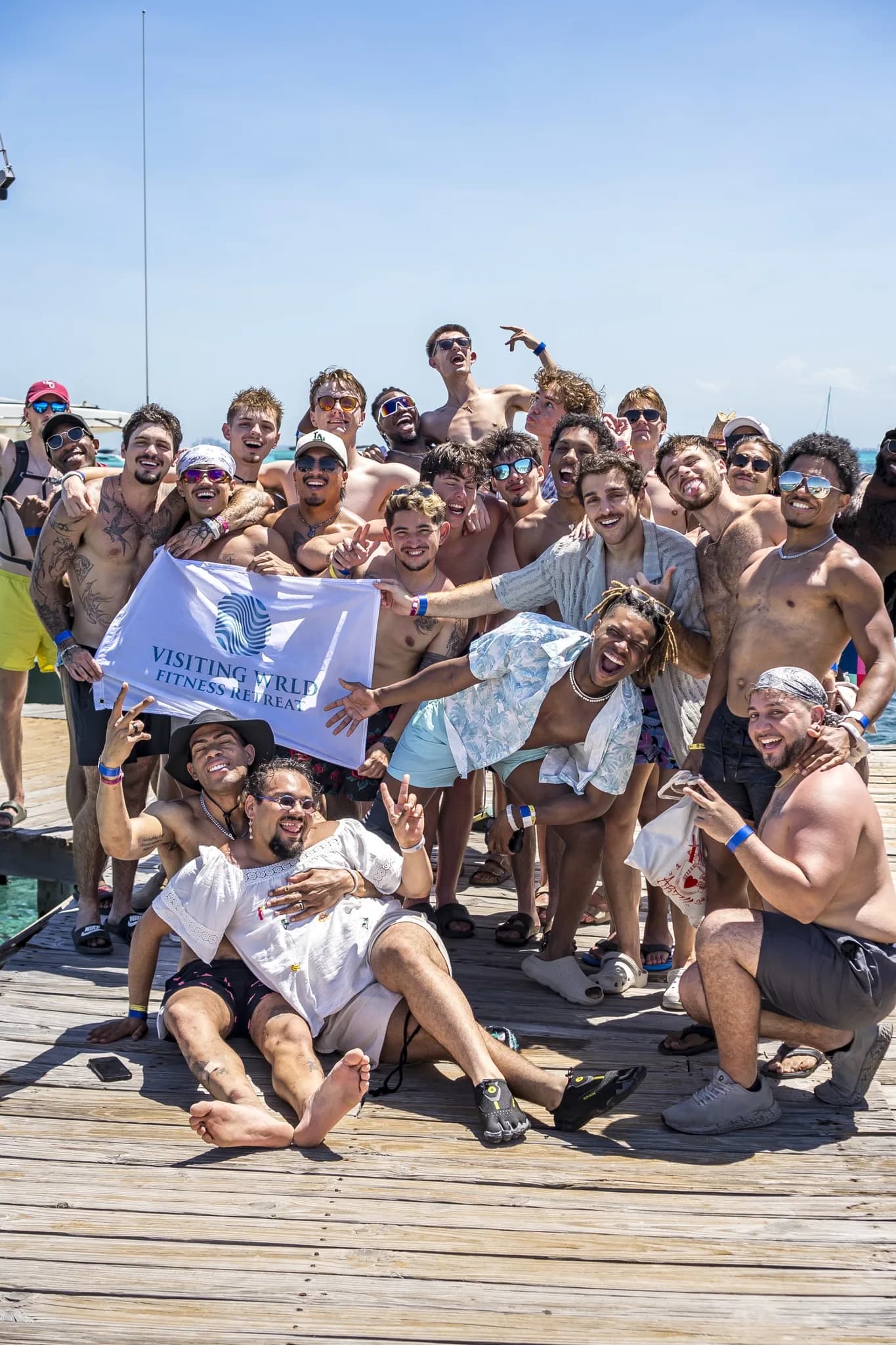 The group with the Visiting Wrld flag on the dock