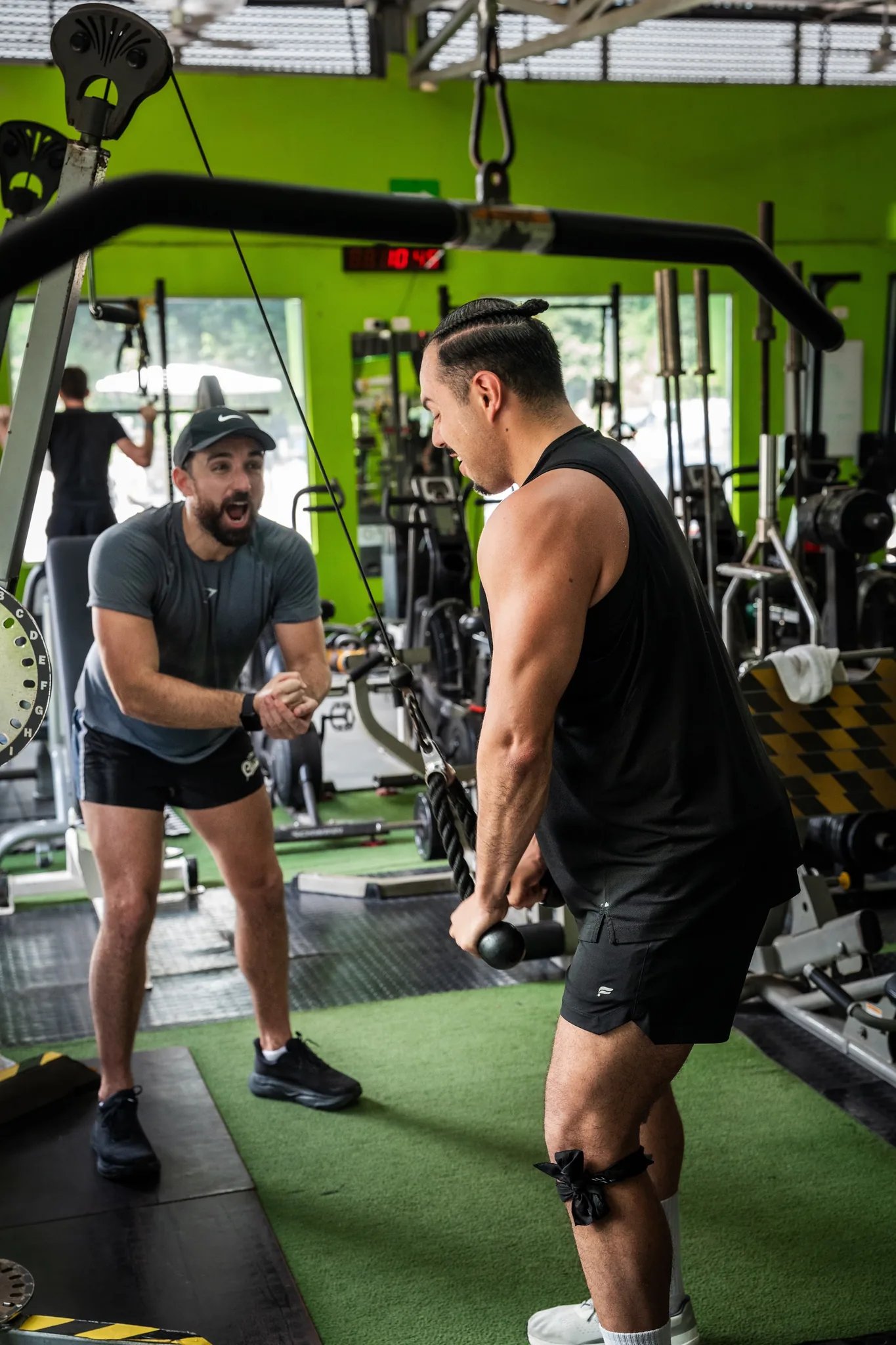 A coach hyping up a retreater through the last reps