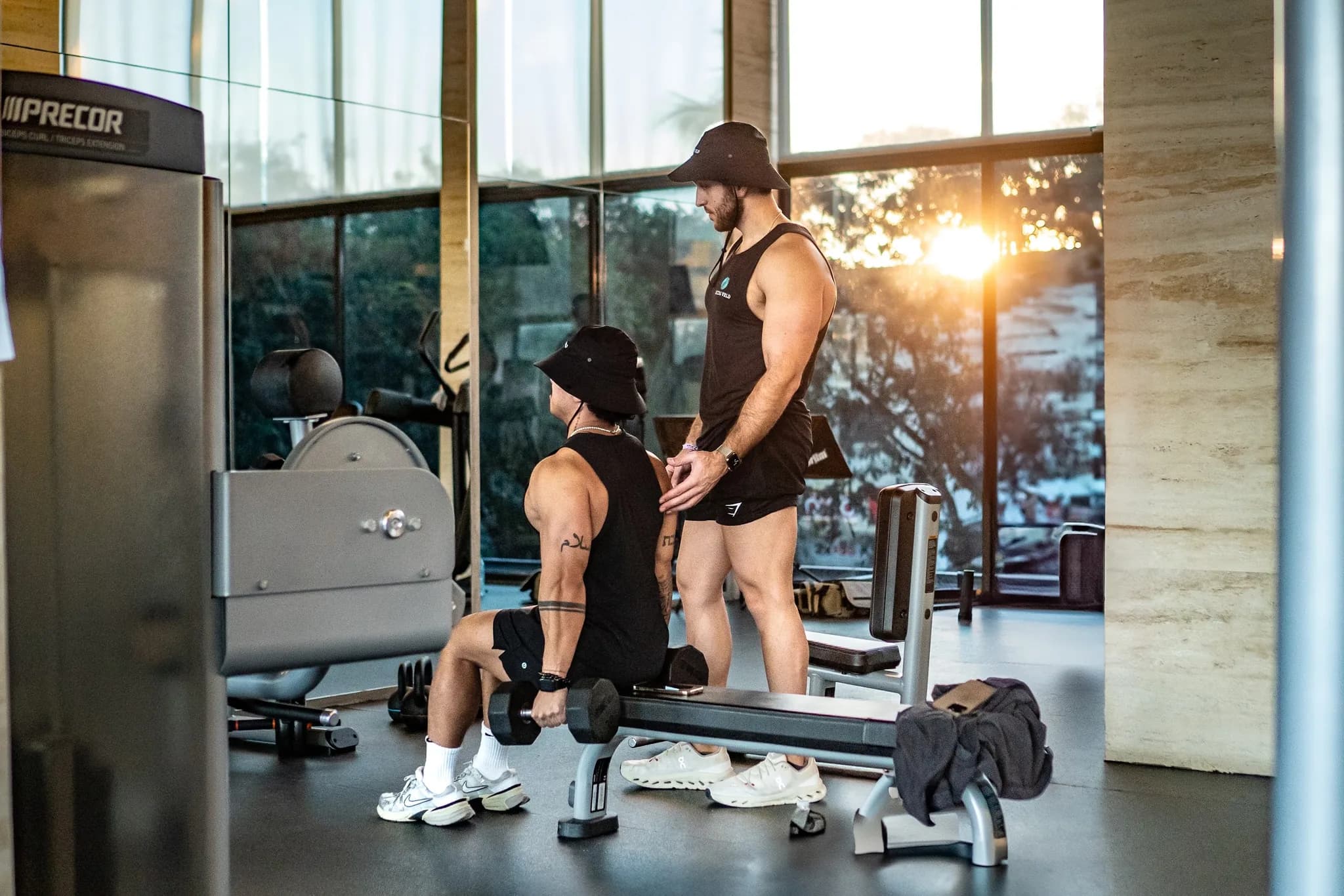 One on one coaching during a sunset lifting session