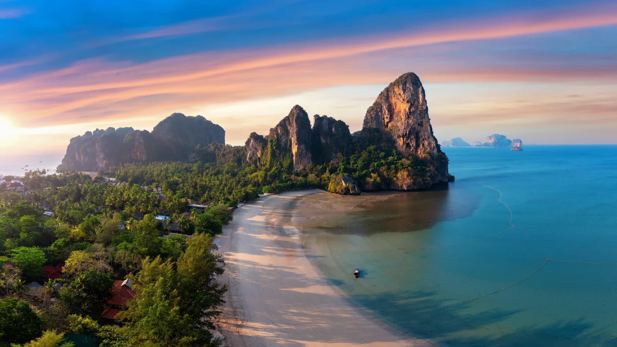 Sunrise over a tropical beach, the kind of destination a lesbian retreat is built around