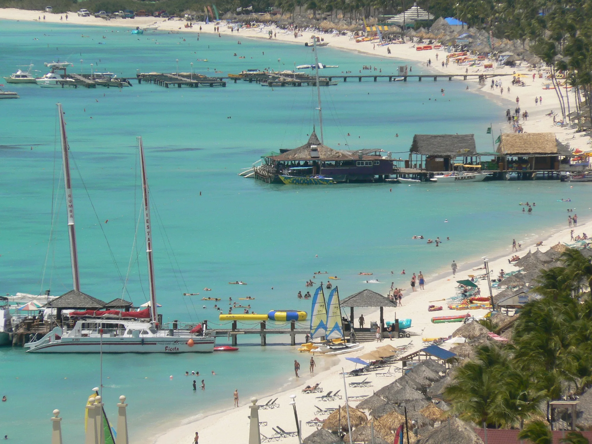 Palm Beach in Aruba seen from above, with white sand and turquoise water