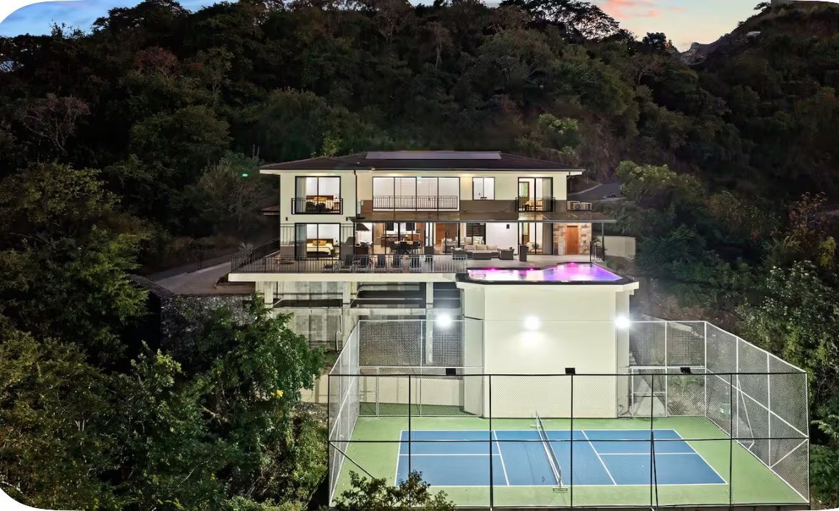 Aerial view of a private villa with a pool, the kind of property gay travelers book instead of a large resort